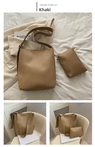 Detail of khaki bucket bag set with matching pouch and wide shoulder strap
