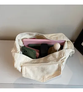 Spacious interior of off-white canvas tote bag showing large capacity for tablets and phones