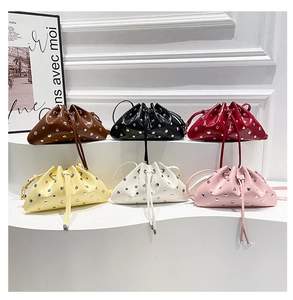 Multiple colors of metallic rivet bucket bags with drawstring closure and slim straps