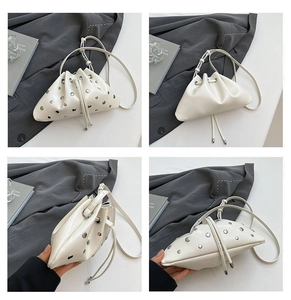 Detailed views of a white triangle bucket bag with silver metal eyelets and drawstring closure