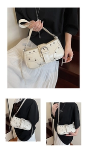 Détail du sac sous le bras crème vintage avec boucle argentée et rivets métalliques