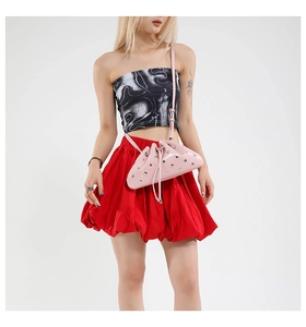 Pink metallic cloud bag featuring silver rivet studs and a drawstring closure