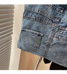 Close-up of vintage blue denim tote bag showing washed fabric and stitching details