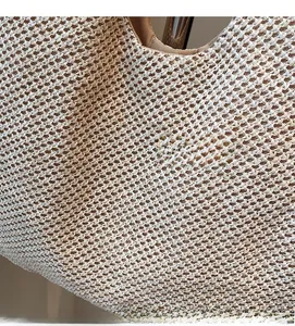 Macro detail of high-quality beige woven texture and fabric lining of the tote bag