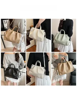 Detail view of ruched PU leather tote in beige, cream, green and black colors