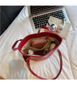 Red crocodile pattern tote bag interior with spacious compartments and magnetic closure