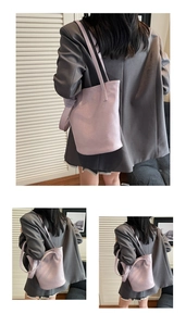 Detail of light purple crocodile texture on large tote bag with slender straps
