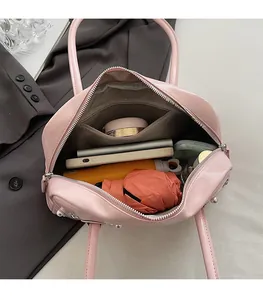 Top view of pink patent leather handbag showing spacious interior and storage capacity