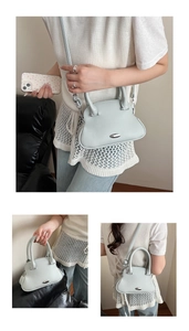 Detailed views of light blue lychee-textured shell bag being worn by hand and crossbody