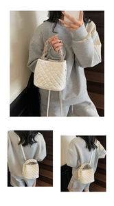 White quilted bucket bag with rhinestones shown in various carrying styles and angles