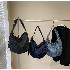 Detail view of denim crossbody bags in three washes with cargo pockets and contrast stitching