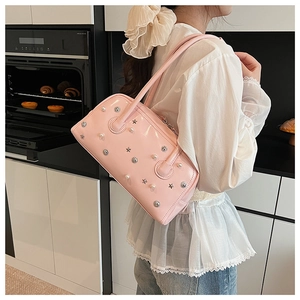 Pink glossy shoulder bag with silver star studs and white pearls detail