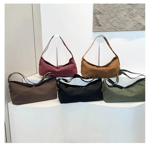 Detail showing five colors of hobo bags with silver rivets and adjustable straps