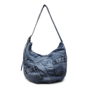 Large denim patchwork hobo bag with vintage wash textures and adjustable wide shoulder strap