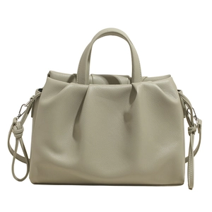 Chic beige pleated crossbody bag with top handles and adjustable shoulder strap