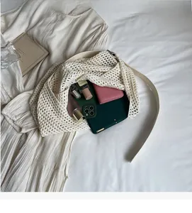 Interior view showing the large storage capacity of this beige crochet woven tote bag