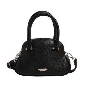 Minimalist black pebble leather handbag with silver hardware and detachable strap