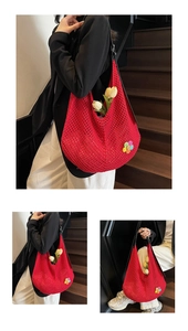 Multiple views of a red knit hollow tote bag with a rainbow flower and black straps