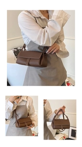 Detail of dark brown lychee leather bag with white stitching and flap closure