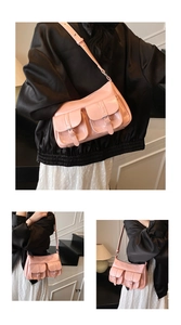 Dettaglio borsa tote in pelle verniciata rosa con tasche con fibbia e tracolla regolabile