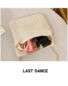 Detail of straw tote bag interior showing capacity for phone, sunglasses and cosmetics