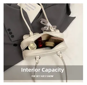 Macro view of interior storage capacity in cream PU leather Boston bowling bag