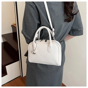 White lychee texture Boston bag with adjustable strap and silver whale charm detail