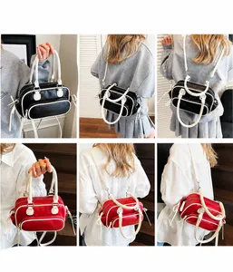 Detail view of two-tone vintage backpacks in black-white and red-white color options