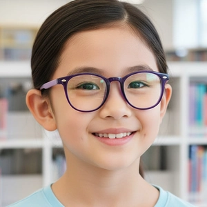Kids purple round blue light blocking glasses shown in a bright library setting