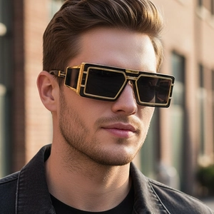 Détail de lunettes de soleil rectangulaires de luxe avec monture noire et bords en métal doré