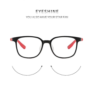Detail of square children's glasses featuring a black frame and red decorative accents