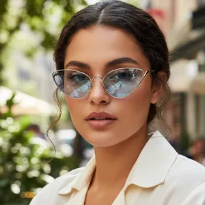 Retro cat-eye sunglasses with thin gold metal frame and light blue lenses for outdoor fashion