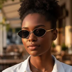Vintage oval sunglasses with minimalist gold metal frame and dark lenses for outdoor fashion