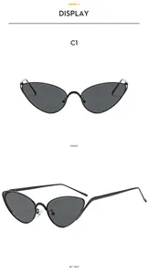 Detailed view of black metal cat-eye sunglasses with cutout temple design details