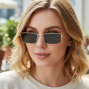 Vintage gold metal rectangle sunglasses with dark lenses worn by a female model