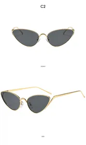 Front and side view of C2 retro cat-eye sunglasses with slim gold metal frames and dark lenses