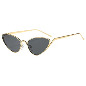 Retro cat-eye sunglasses with thin gold metal frames and dark lenses shown in a 45-degree view