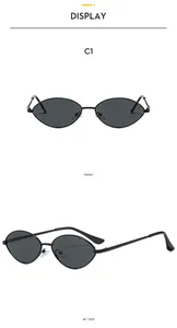 Detailed front and side views of vintage oval sunglasses with slim black metal frames