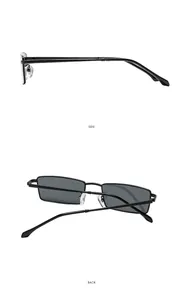 Detail view of square metal sunglasses with slim black frames and dark grey lenses