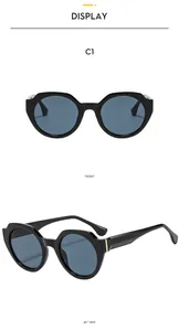 Vue de face et de profil de lunettes de soleil géométriques noires à détails en métal