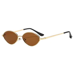 Vintage oval sunglasses with slim gold metal frames and dark brown lenses for women
