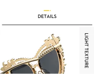 Detailed close-up of luxury gold metal sunglasses frame with rhinestone-encrusted engraving