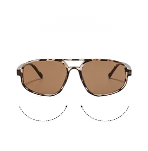 Detailed macro view of vintage tortoise shell aviator sunglasses with brown gradient lenses