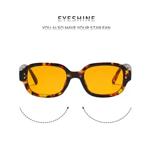Detailansicht der Retro-Rechteck-Sonnenbrille mit Tortoise-Rahmen und orangefarbenen Gläsern