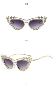 Front and side views of gold cat-eye sunglasses with luxury crystal floral details