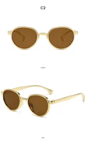 Detailed front and side view of round gold metal frame sunglasses with brown lenses