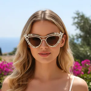 Luxury oversized cat-eye sunglasses with rhinestone trim and floral crystal accents