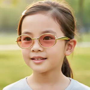 Kids vintage oval sunglasses with gold metal frame and peach tinted lenses for outdoor style