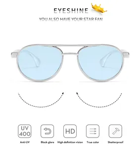 Detail of retro kids double bridge sunglasses with blue lenses and silver frame