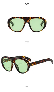 Détail de lunettes de soleil oversize en écaille avec des verres vert clair en C9